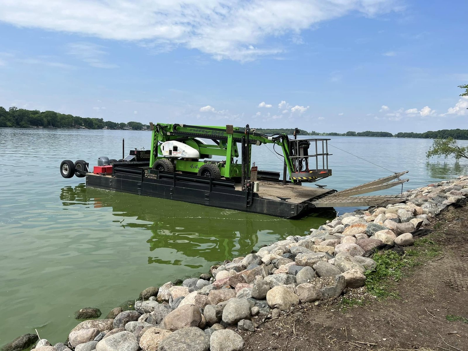 Restoration barge at lakeside dock